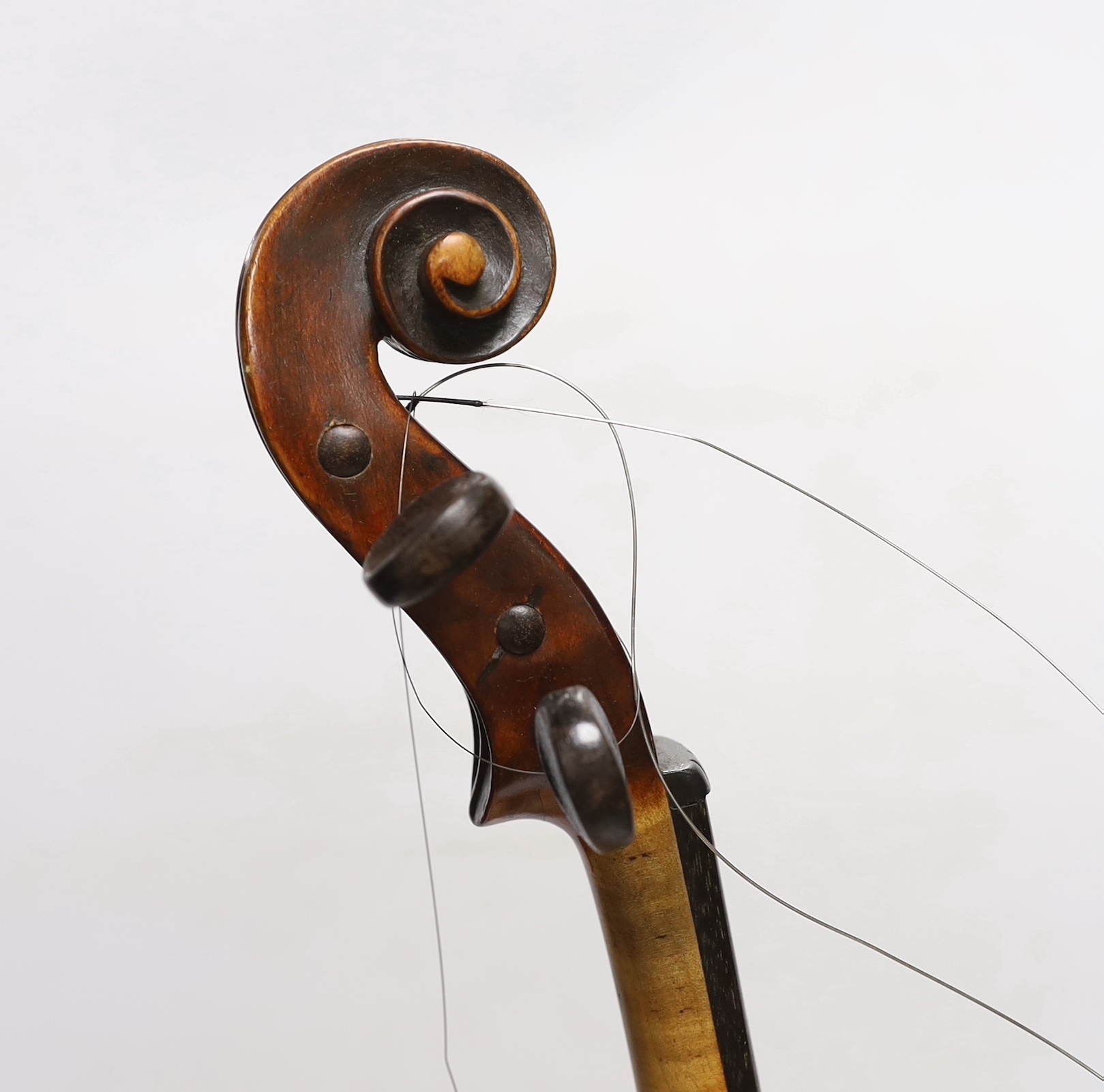 A violin labelled 'Albani Palermo', cased, length of back 35.5cm